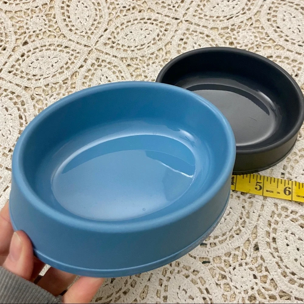 Two pet food + water bowls